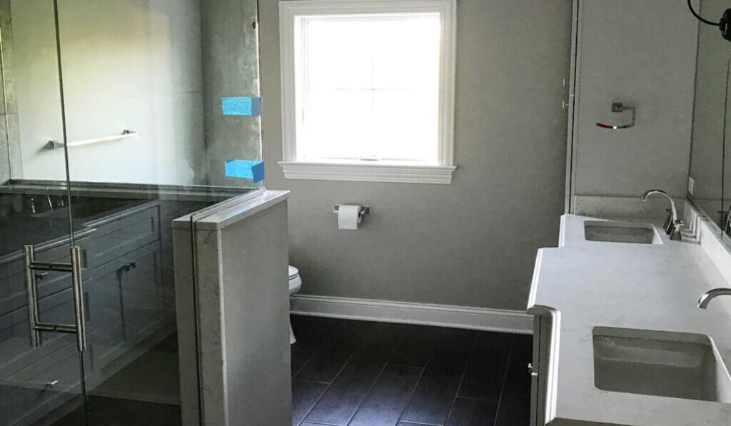 a small bathroomm with a walk-in shower